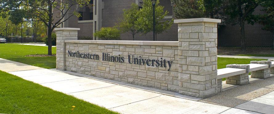 A low wall will Northeastern Illinois University spelled out on it
