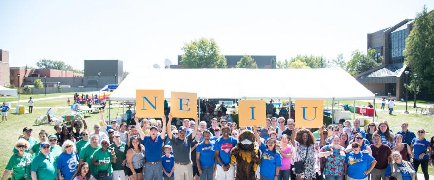 NEIU Weekend guests assembled on the University Commons for a group photo