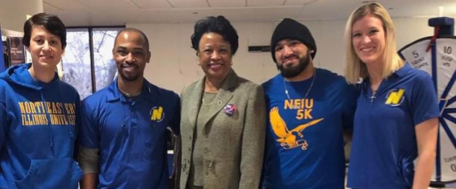NEIU President Dr. Gloria Gibson and four HSPE Students
