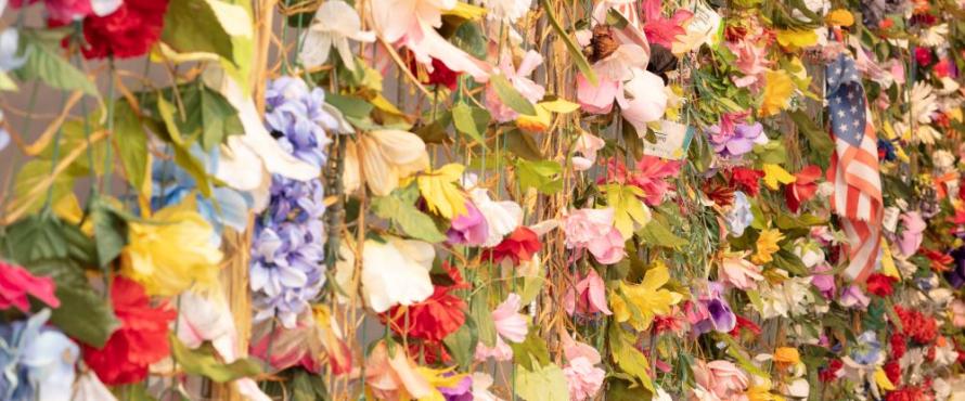 Close up view of woven flowers hanging like a tapestry
