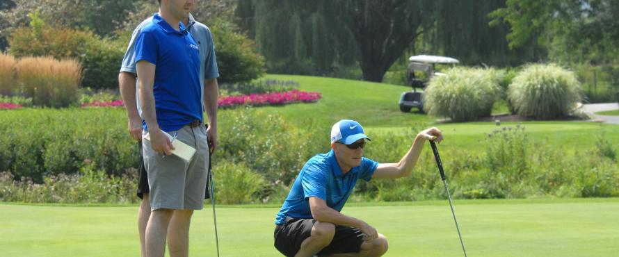 John G. Findley lines up a putt at the Chuck Kane Scholarship Golf Event on Aug. 18, 2014.