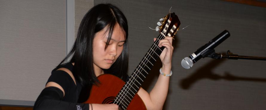 Xiaoxuan Wu performs performs at the fourth annual Scholar-Donor Luncheon on April 14, sponsored by the NEIU Foundation.