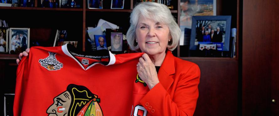 President Hahs with a red Blackhawks jersey