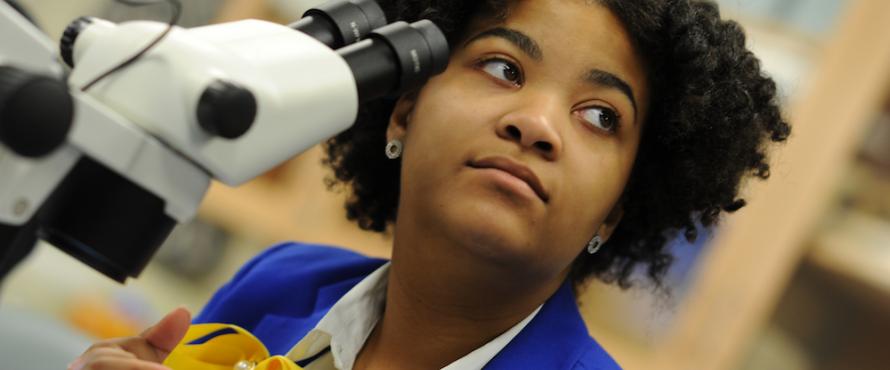 Northeastern Illinois University biology student Alexis Chappel listens during a session in a biology lab.