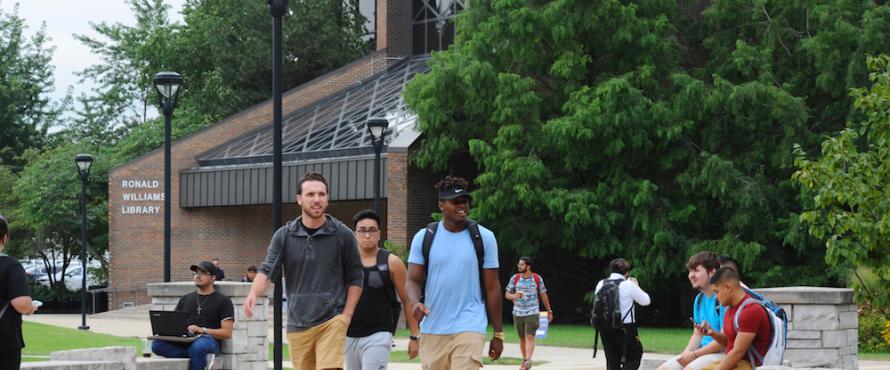 Students walk across the University Commons.