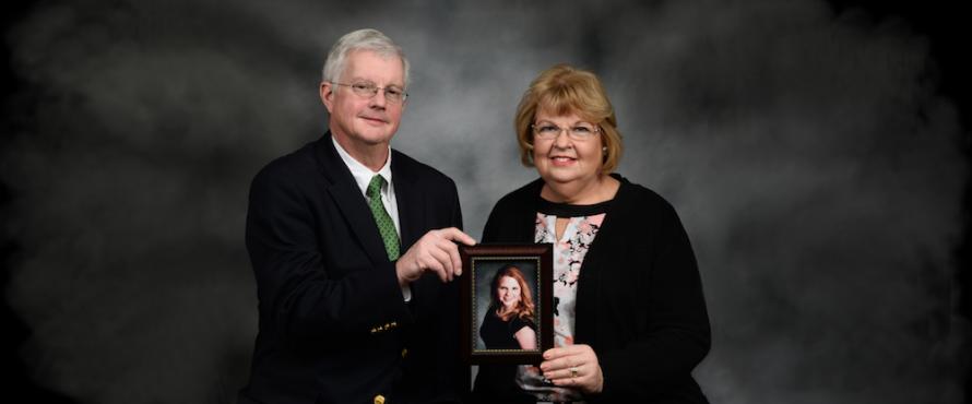 John and Eileen Kelly hold a photo of their daughter, Katie Kelly.