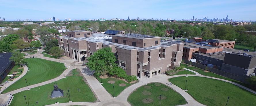 Aerial image of Northeastern's Bernard Brommel Hall with the Chicago skyline in the background