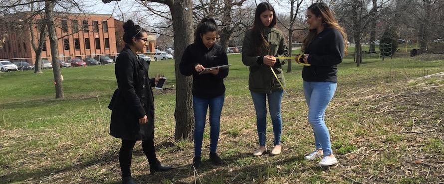 Alison Bonilla, Maricarmen Tellez, Millenia Jimenez and Olga Alfaro participate in a Biology class tree exercise.