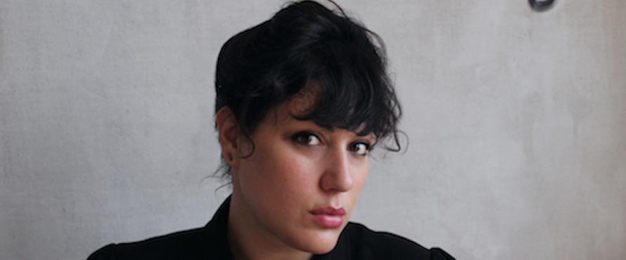 Photo of Amanda Goldblatt in a black top against a gray background