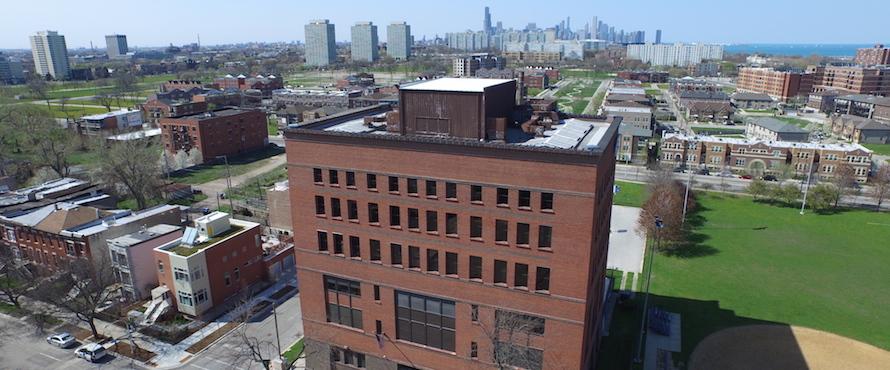 An aerial view of the Carruthers Center with the Chicago skyline in the background.