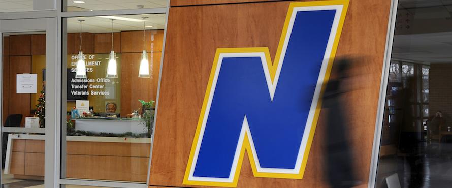 NEIU's flying N logo adorns the entrance to the Admissions Office