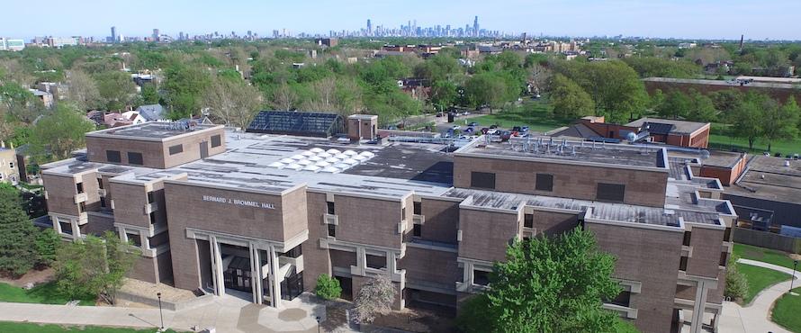 An aerial view of Brommel Hall with the Chicago skyline in the background.