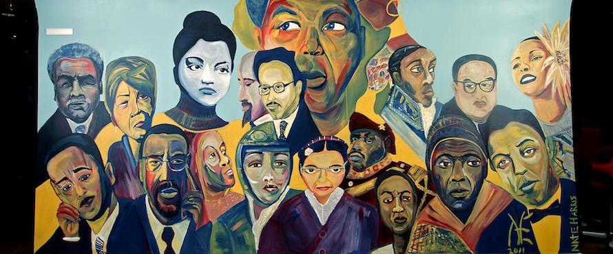A mural of diverse faces in the Pedroso Center.