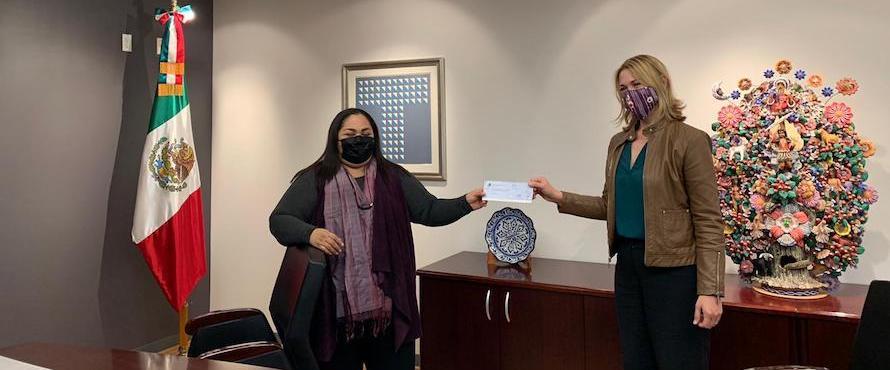 Ambassador Reyna Torres Mendivil, Consulate General of Mexico in Chicago, presents Liesl Downey, Executive Director of the NEIU Foundation, with the 2020 IME Becas grant on Oct. 19.