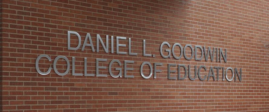 Photo of the Daniel L. Goodwin College of Education sign on the exterior of Northeastern's LWH building.