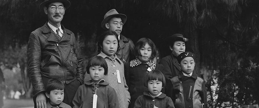 Members of the Mochida family awaiting evacuation bus. Photo by Dorothea Lange, Hayward, California, May 8, 1942, Courtesy of National Archives and Records Administration, Records of the War Relocation Authority 