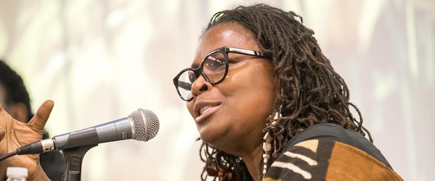 Photo of Dr. Sharon L. Bethea speaking at a microphone 