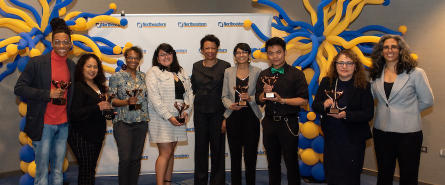 A photo of President’s Inclusive Excellence and Diversity Award recipients holding their awards with President Gloria J. Gibson (center) with Executive Director of Equity, Diversity and Inclusion Shireen Roshanravan (far right).