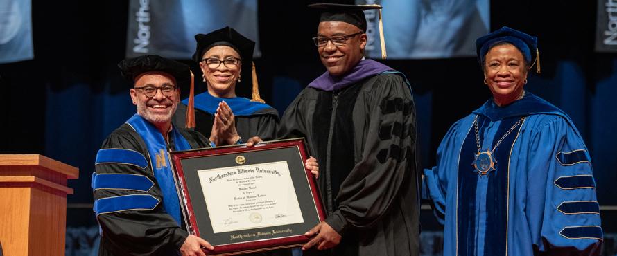 University administrators present Kwame Raoul with an honorary doctor of humane letters
