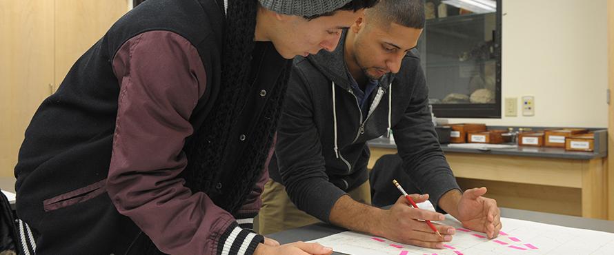 Two male students working on a project.