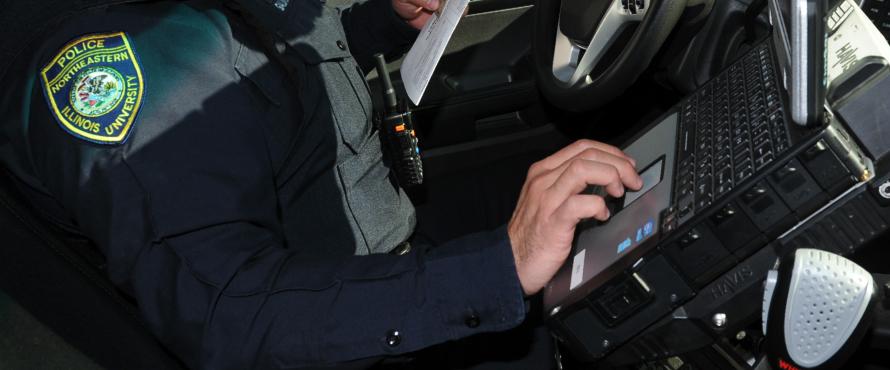 Police typing on computer