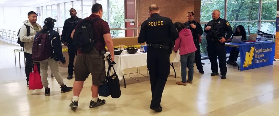 Students interact with police officers during a Coffee With a Cop event.
