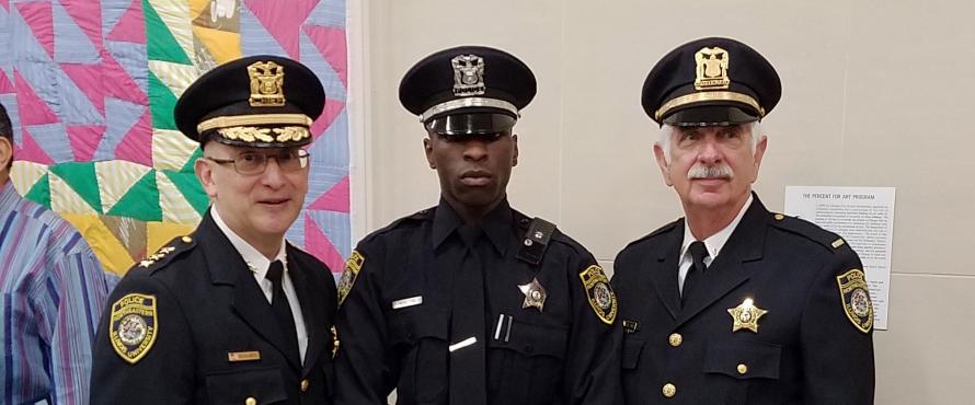 New officers pose in uniform.