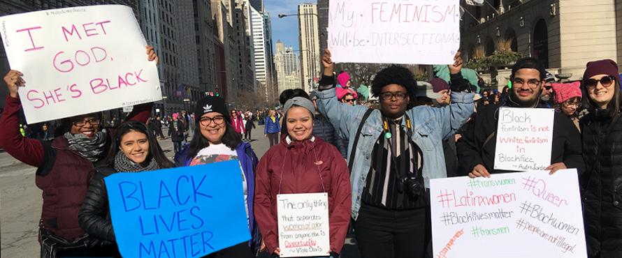 WGS Students hold signs at 2018 Women's March
