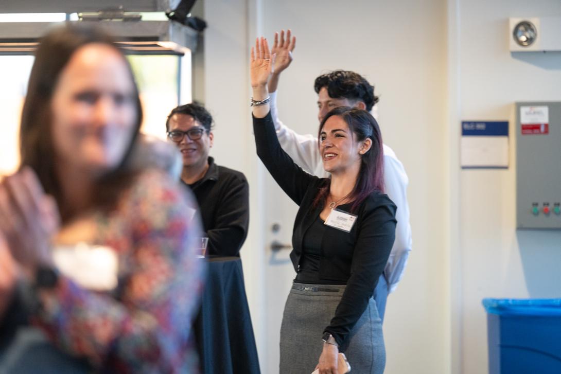 a women raises her hand 