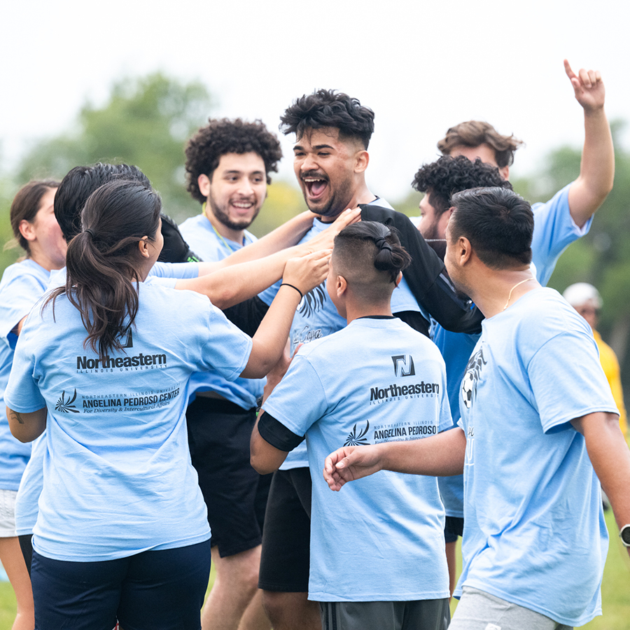 Students playing soccer and celebrating