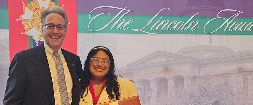 A photo of Jon Hageman, Ph.D., (left) with Cassaundra Garcia (right) smiling at The Lincoln Academy awards ceremony. 
