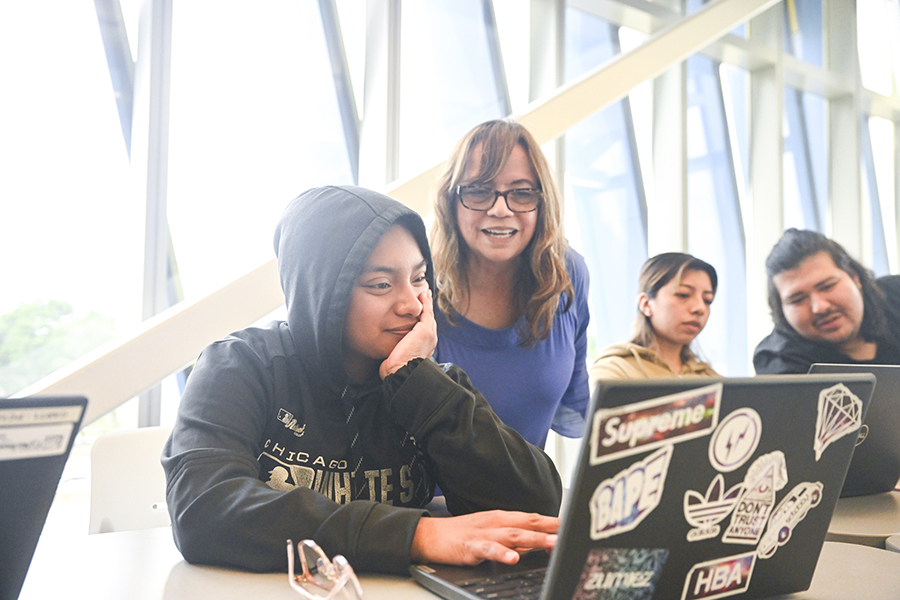 Students and staff working on computer projects at El Centro