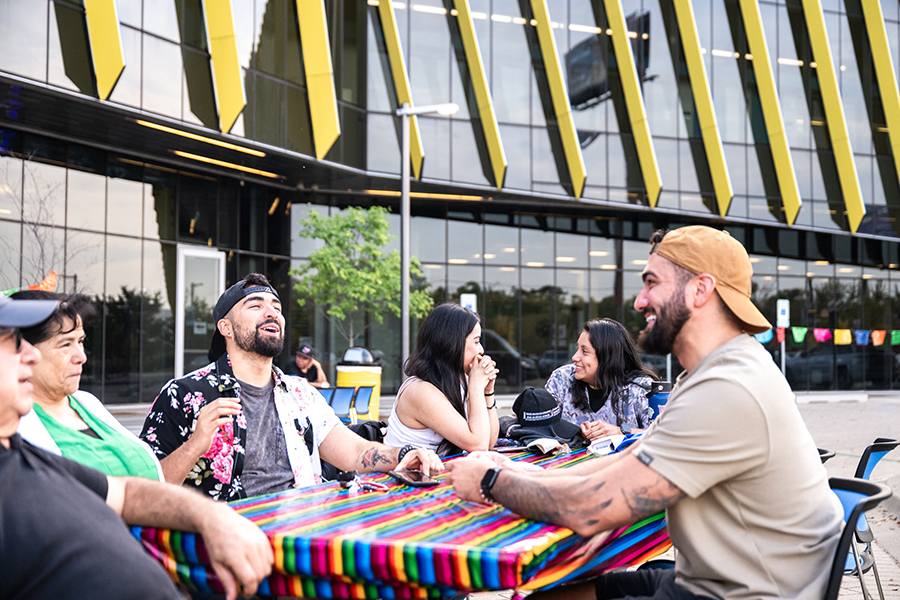 People laughing and talking outside of El Centro