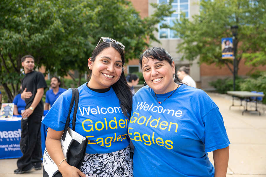 Two women smiling and posing for a photo.