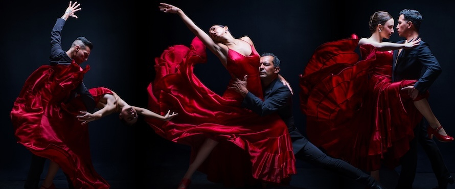 A photo of six Ensemble Español dancers (three in red flamenco gowns, three in dark suits) in dance poses against a black background. Photo by Joel Maisonet.