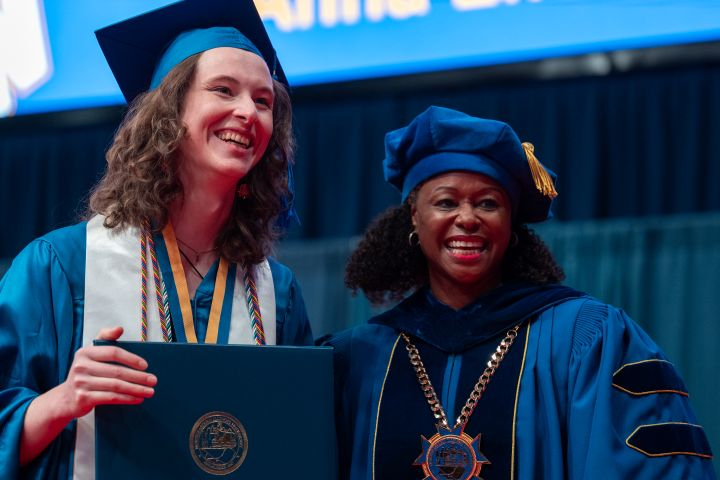 Spring 2026 Commencement Gradaute with Dr. Bell-Jordan