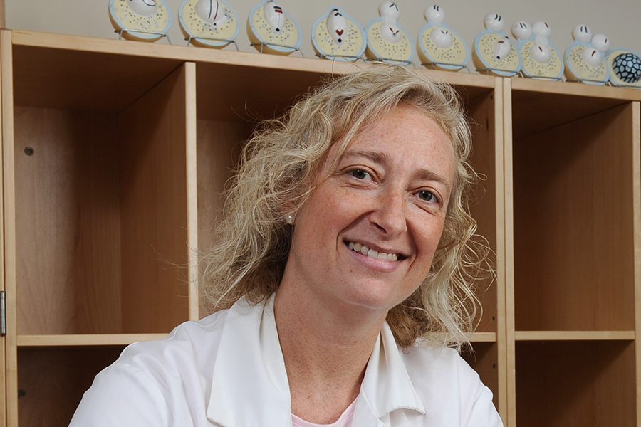 Pam Geddes smiling in the lab