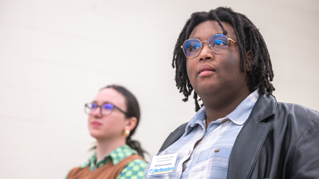 Woman and Man listening to a presentation.