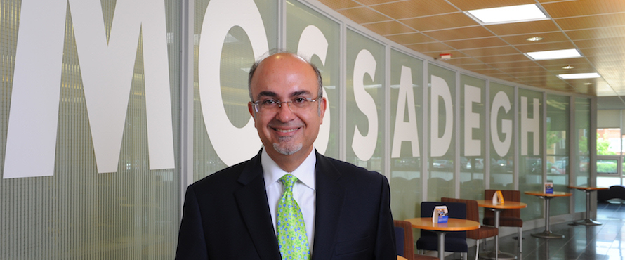 Mateo Farzaneh poses in Mossadegh Servant Leaders Hall.