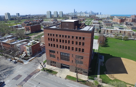 The Carruthers Center building is shown with the Chicago skyline in the background.