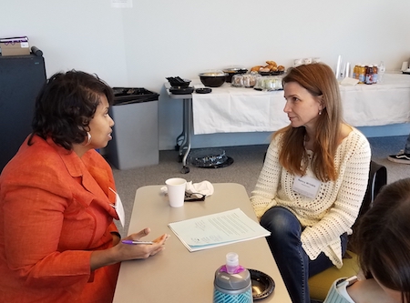 Dr. Carmen McCallum (left) confers with Northeastern Mathematics faculty member Nancy Wrinkle.