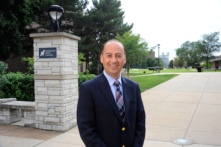 Daniel Lopez Jr. stands outdoors at the Main Campus