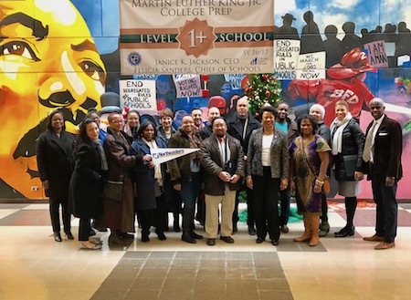 Gloria J. Gibson and a number of university faculty and staff visiting one of six Chicago public high schools