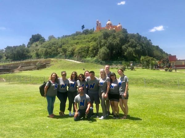 The Northeastern contingent poses for a photo at the Great Pyramid of Cholula.
