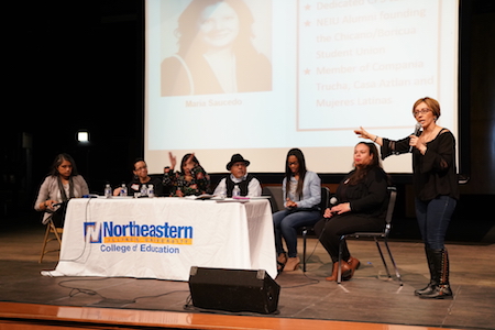 Panelists sit at a table during the People's Education Forum.