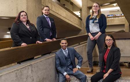 Three female and two male MARC Scholars pose inside Bernard Brommel Hall